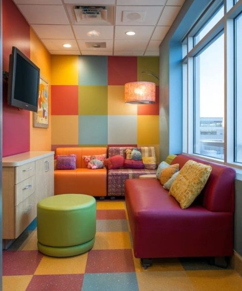 Colorful pediatric hospital buildout with vibrant furnishings